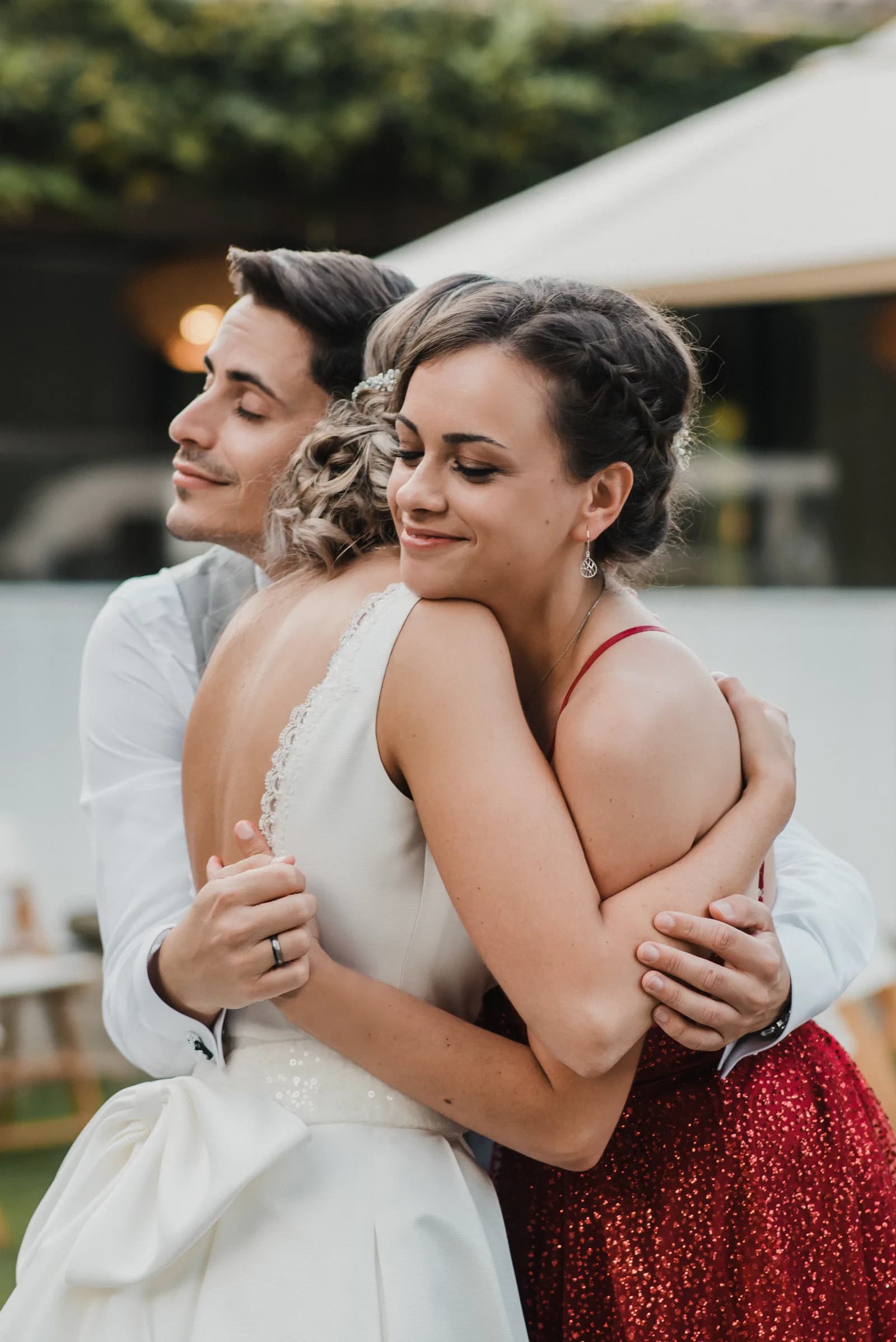 Guests embracing the couple through the camera